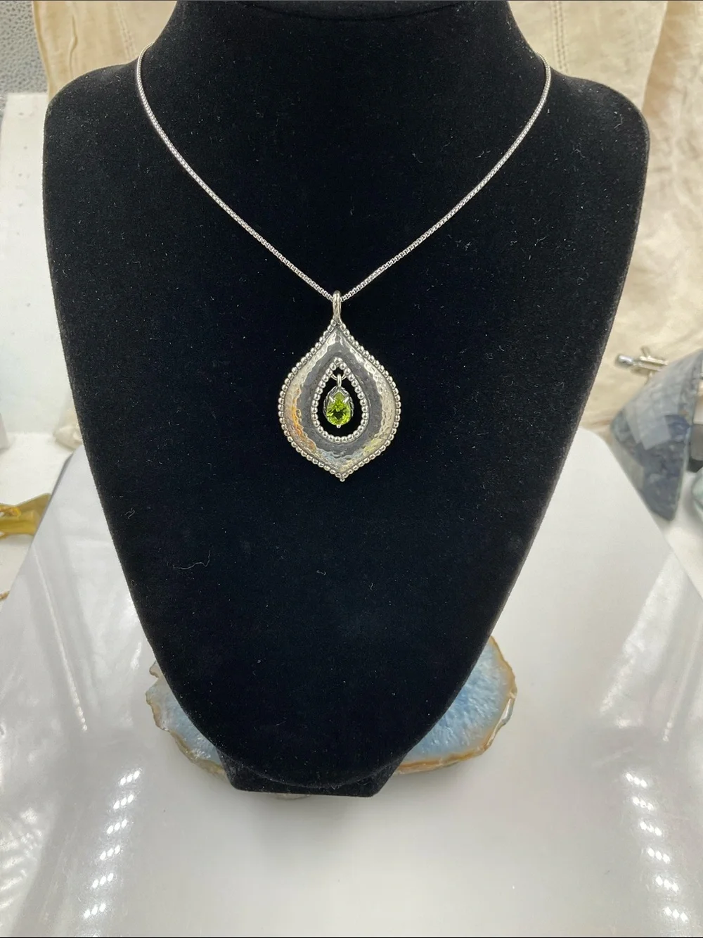 Sterling Silver Teardrop Pendant Necklace Featuring A Faceted Peridot Gemstone